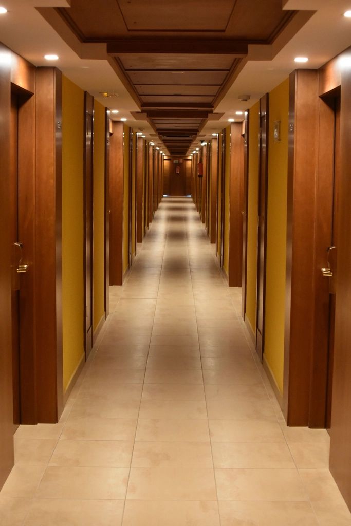 A warm hotel corridor in the evening