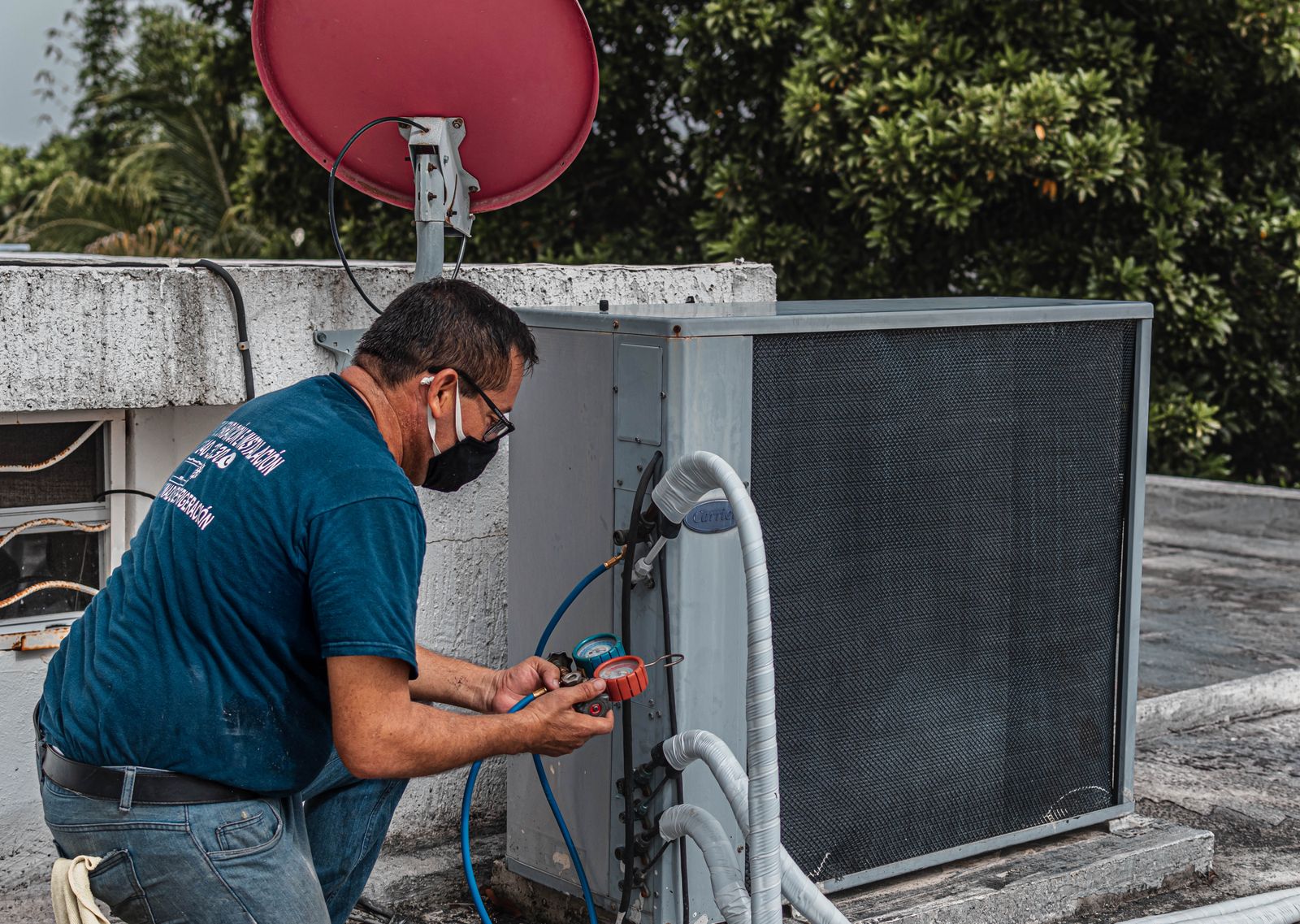 An HVAC technician servicing a unit