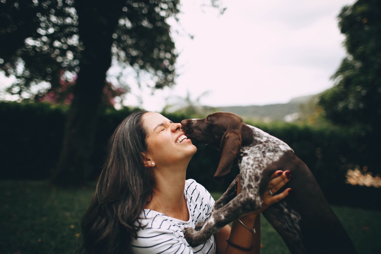 A pet owner with a happy dog