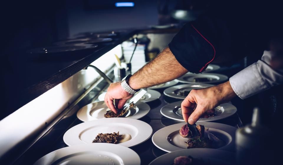 A busy restaurant kitchen pass